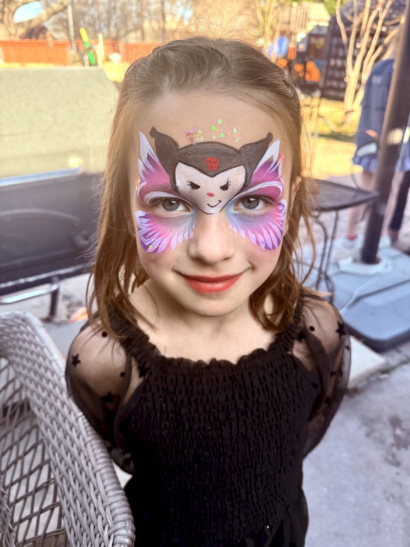 Detailed pink and purple face painting by CandyProArt