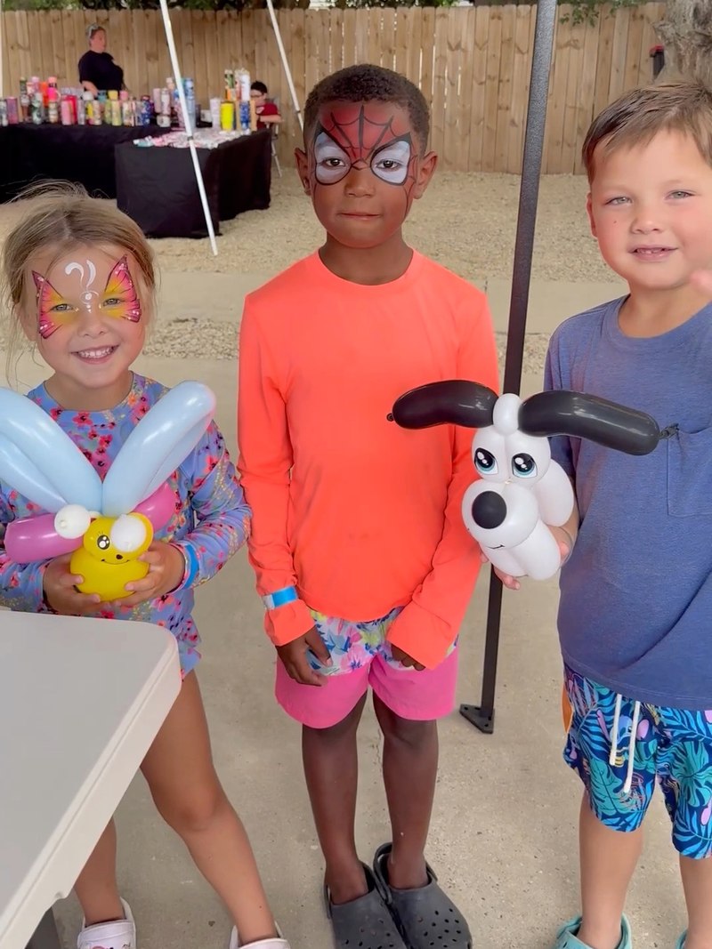 Children with CandyProArt face painting and balloon creations
