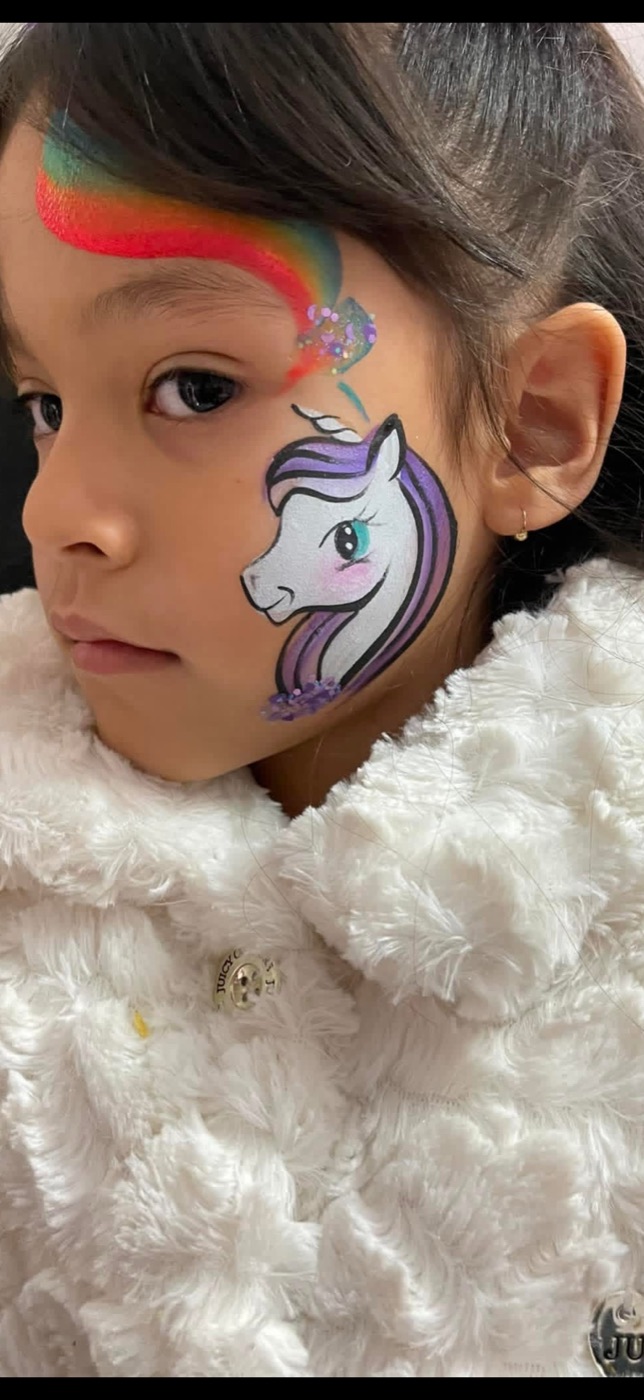 Rainbow and purple unicorn cheek painting